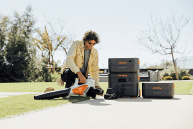 Jackery Solar generators paired with electric lawnmower