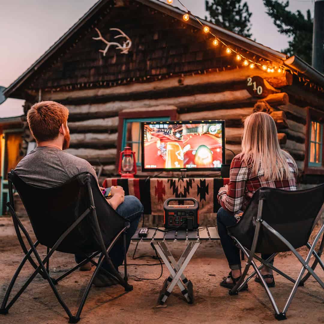 Jackery Explorer 300 Portable Power Station is running a TV that plays switch.